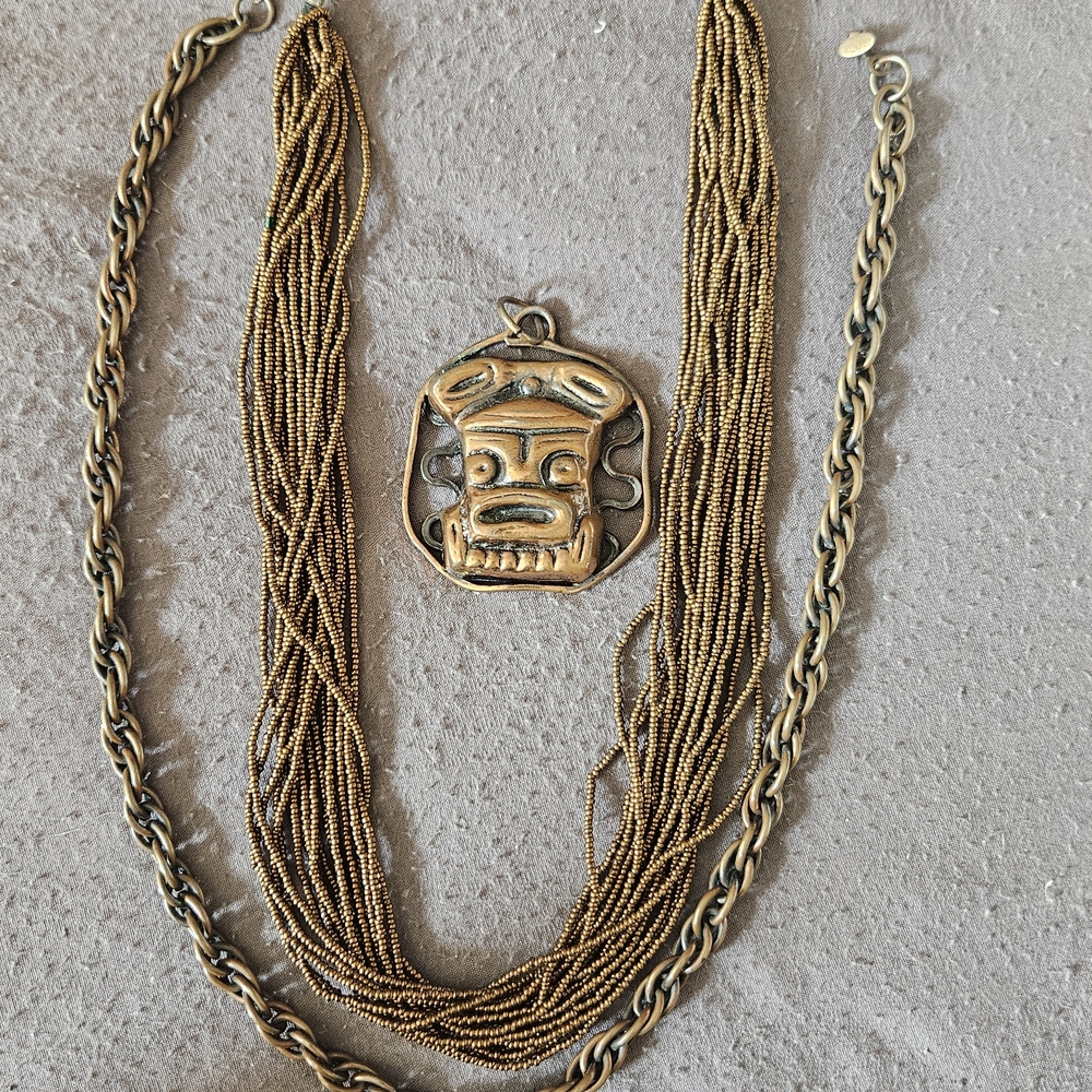 Elegant Gold Necklace with Tribal Pendant